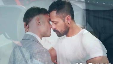 Suited stud Cristian Sam drills Manuel Reyes ass deep in office