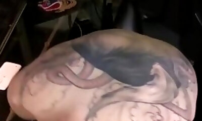 Inked punk jerking off while watching hard Japanese porn