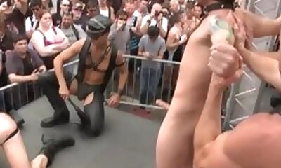 Dude gets his balls crushed in public during a crazy BDSM show!